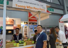 Sales representatives from Joon International Co., Ltd. The company supplies a variety of fresh fruits from South Korea, including melons, grapes, and peaches.